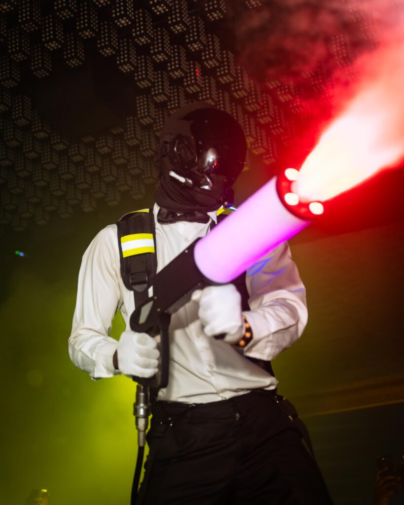 A waiter using the smoke gun at The Library Lagos