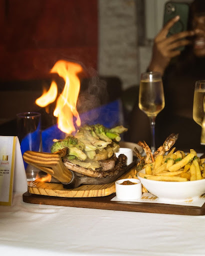 An image of steak and yam chips in The Library Lagos